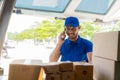 Young black male courier happy delivery with technology, tracking and courier service concept.