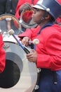 Young black male drummer in a marching band in the Cherry Blossom Festival in Macon, GA