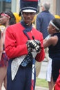 Young black male drummer in a marching band in the Cherry Blossom Festival in Macon, GA