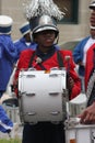 Young black male drummer in a marching band in the Cherry Blossom Festival in Macon, GA