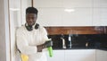 Young black man admiring cleanlines of the kitchen after work