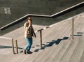 Young black man climbing stairs and talking on the phone Royalty Free Stock Photo