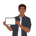 Young black man holding digital tablet, showing screen with blank copy space Royalty Free Stock Photo