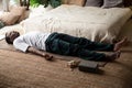 Young black man lying in Dead Body exercise or Corpse pose with his eyes closed, Savasana pose Royalty Free Stock Photo