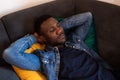 Young Black Man Napping on Couch Royalty Free Stock Photo