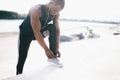 Young black man runner tying his shoelaces Royalty Free Stock Photo