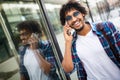 Young black man smiling and talking on mobile phone outside Royalty Free Stock Photo