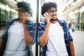 Young black man smiling and talking on mobile phone outside Royalty Free Stock Photo