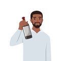 Young black man standing holding bottle of wine offering to his friend Royalty Free Stock Photo