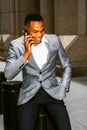 Young black man talking on cell phone on street in New York City Royalty Free Stock Photo