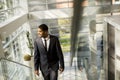 Young black man walking in office Royalty Free Stock Photo