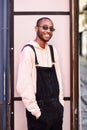 Young black man wearing casual clothes and sunglasses outdoors Royalty Free Stock Photo