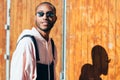 Young black man wearing casual clothes and sunglasses outdoors Royalty Free Stock Photo