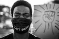 Young black man wearing face mask during equal rights protest - Concept of demonstrators on road for Black Lives Matter and I Can