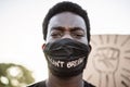 Young black man wearing face mask during equal rights protest - Concept of demonstrators on road for Black Lives Matter and I Can Royalty Free Stock Photo