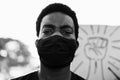 Young black man wearing face mask during equal rights protest - Concept of demonstrators on road for Black Lives Matter and I Can