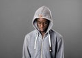 Young Black man wearing a grey hoodie looking down Royalty Free Stock Photo