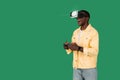 Young Black man wearing VR headset, enjoy playing video game Royalty Free Stock Photo