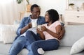 Young black man and woman enjoying weekend at home together Royalty Free Stock Photo