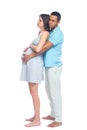 A young black man helps his white wife with birth pain with a ball. Partnered birth, partnered delivery. Isolated white