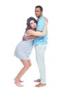 A young black man helps his white wife with birth pain with a ball. Partnered birth, partnered delivery. Isolated white