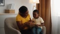 Young Black Mother And Her Little Son Reading Book Together At Home Royalty Free Stock Photo