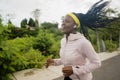 Young black  runner girl enjoying outdoors jogging workout - young attractive and fit African American woman running at Royalty Free Stock Photo