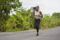 Young black  runner girl enjoying outdoors jogging workout - young attractive and fit African American woman running at Royalty Free Stock Photo