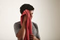 Young black sportsman wiping his face with a towel Royalty Free Stock Photo