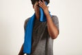 Young black sportsman wiping his face with a towel Royalty Free Stock Photo