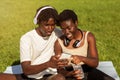 Young Black Sporty Couple Using Fitness App On Smartphone After Training Outdoors Royalty Free Stock Photo
