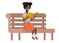 Young black student girl sitting reading book Royalty Free Stock Photo