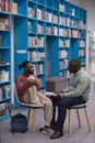 Young black student talking to therapist or guidance counselor in college Royalty Free Stock Photo