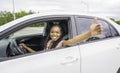 Young black teenage driver seated in her new car Royalty Free Stock Photo