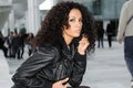 Young black woman, afro hairstyle, in urban background