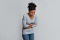 Young black woman having menstrual abdominal pain