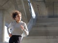 Young black woman jogging outdoors Royalty Free Stock Photo