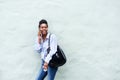 Young black woman laughing and talking on cellphone Royalty Free Stock Photo