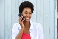 Young black woman smiling and talking on mobile phone Royalty Free Stock Photo