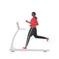 Young black woman in a sporty uniform is running on a treadmill Royalty Free Stock Photo