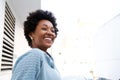 Young black woman standing outdoors and smiling Royalty Free Stock Photo