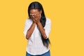 Young black woman wearing casual clothes with sad expression covering face with hands while crying Royalty Free Stock Photo