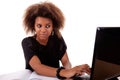 Young black women working on desk looking to Royalty Free Stock Photo