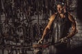 Young blacksmith forging molten metal Royalty Free Stock Photo