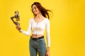 Young blogger girl with three-axis electronic stabilizer gimbal. Makes a selfie and video blog. Royalty Free Stock Photo