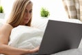 Woman work winh laptop stay in bed early morning Royalty Free Stock Photo