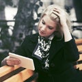 Young fashion blond business woman using digital tablet computer Royalty Free Stock Photo