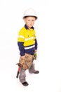 Young blond caucasian boy looking out with a fierce look role playing as a construction worker supervisor Royalty Free Stock Photo