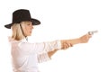 A young blond in a cowboy hat aiming with a gun Royalty Free Stock Photo