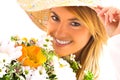 Young blond girl with flowers Royalty Free Stock Photo